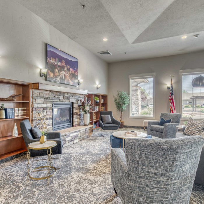 Fireplace and library area at Grace Assisted Living Boise-Eagle
