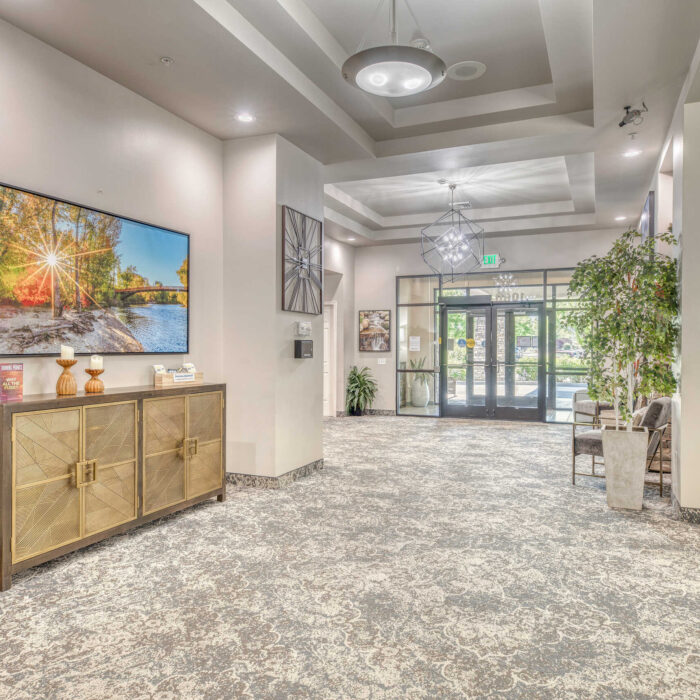 Front lobby with scenic artwork and modern decor at Grace Assisted Living Meridian.