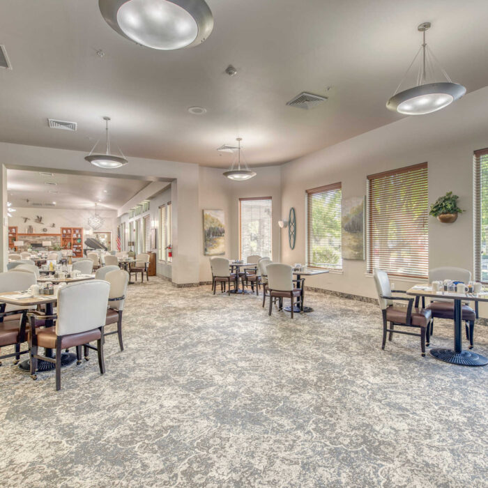 Sunlit dining room with windows and scenic views at Grace Assisted Living Meridian, Idaho.