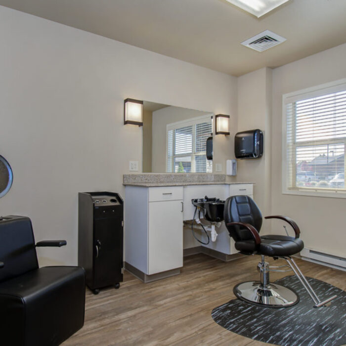 Bright salon with styling stations at Grace Memory Care Caldwell